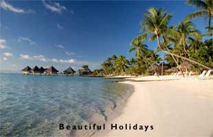 a beach resort with over water bungalows in tahiti