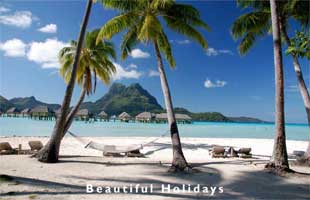 view across lagoon to Bora Bora island from a beach resort