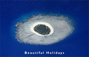 aerial view of an uninhabited coral island in Tonga